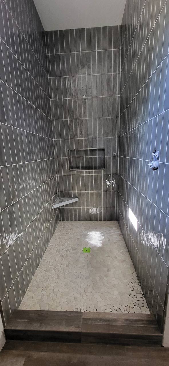 Pebble floor shower